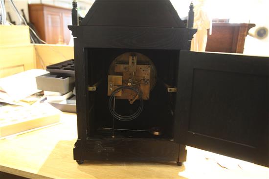 An Aesthetic movement ebonised architectural mantel clock, c.1885, height 20in.